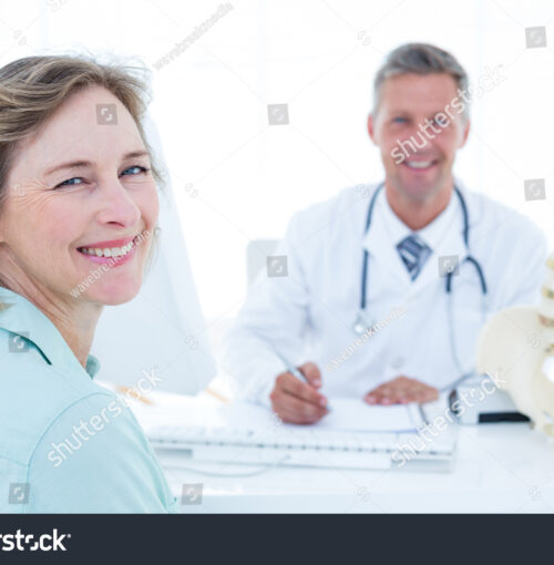 stock-photo-patient-and-doctor-smiling-at-camera-in-medical-office-270885158